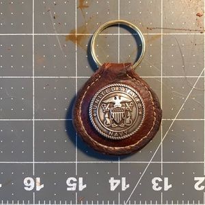 Hand crafted leather keychain with Navy insignia